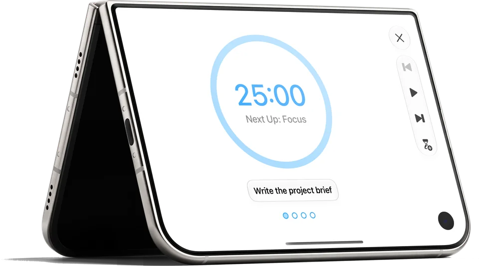 iPhone Duo standing like a tent on its edges, its outer display showing the timer in Focus: 25:00, Next Up: Focus, the task Write the project brief and four dots, with Close, Reset, Start, Finish and Extend in a column beside it